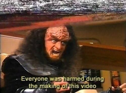 A grainy screencap of a Klingon, subtitled "Everyone was harmed during the making of this video".