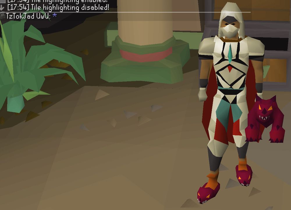 An Old School RuneScape character named "TzTokJad UwU" holding a plushie of TzTok-Jad and wearing matching slippers.