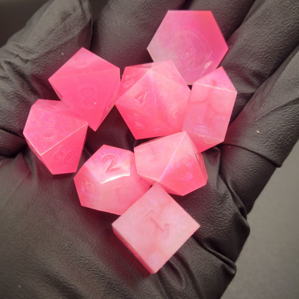 Hot pink neon eight piece dice set for tabletop role playing games 