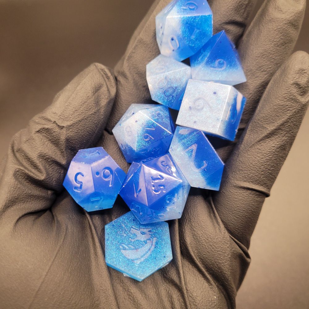 Cool blue neon nine piece dice set for playing tabletop role playing games 