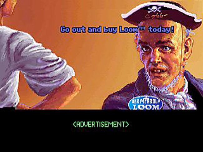 A screenshot from the Secret of Monkey Island featuring pixel art of a pirate wearing a button that reads "ASK ME AABOUT LOOM" The text "Go out and buy Loom(tm) today!" is floating over his head and the words <ADVERTISEMENT> are printed at the bottom of the screen where the players interface usually is.