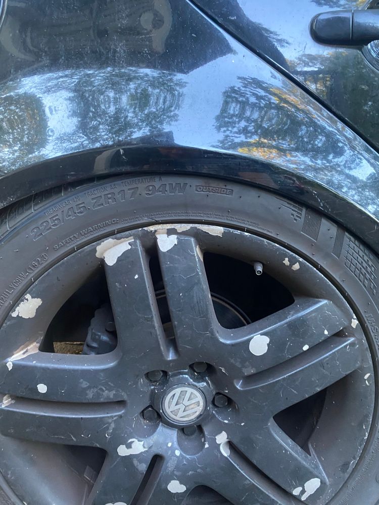 The rear wheel of my VW golf. Pushed under the fender because of the weight of the boxes and my shitty suspension. 