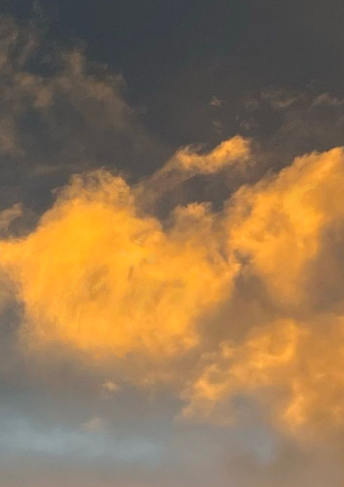 This is a photograph of a cloud at dusk. The cloud has been slightly manipulated in the app, sketchbook to enhance the features. 