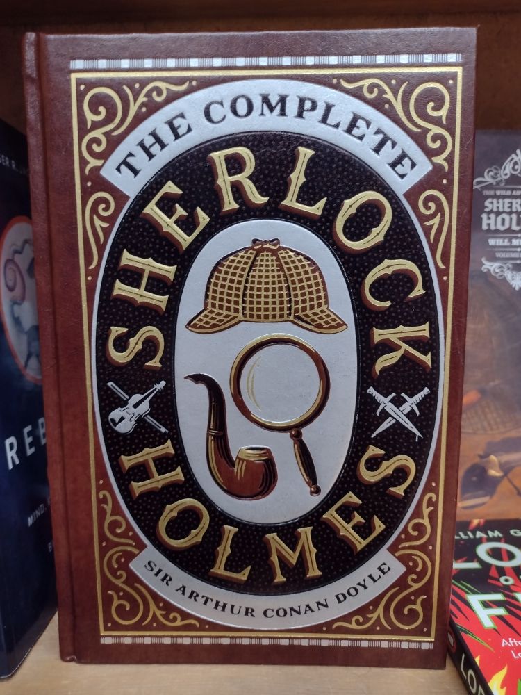 A leatherbound copy of The Complete Sherlock Holmes by Sir Arthur Conan Doyle. 