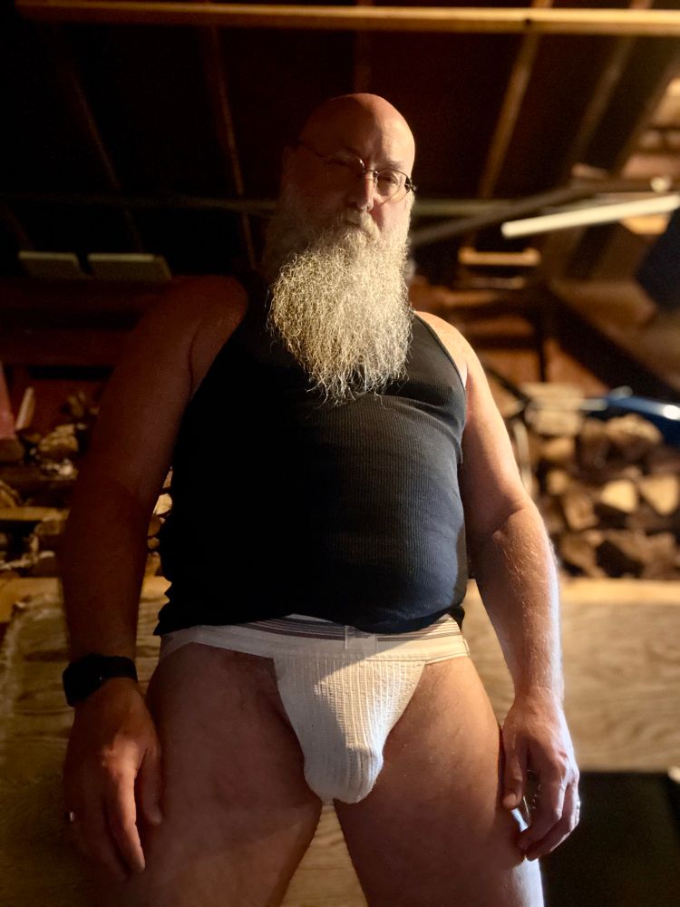 Excalibear in his garage, wearing a black sleeveless undershirt and a new white jockstrap 