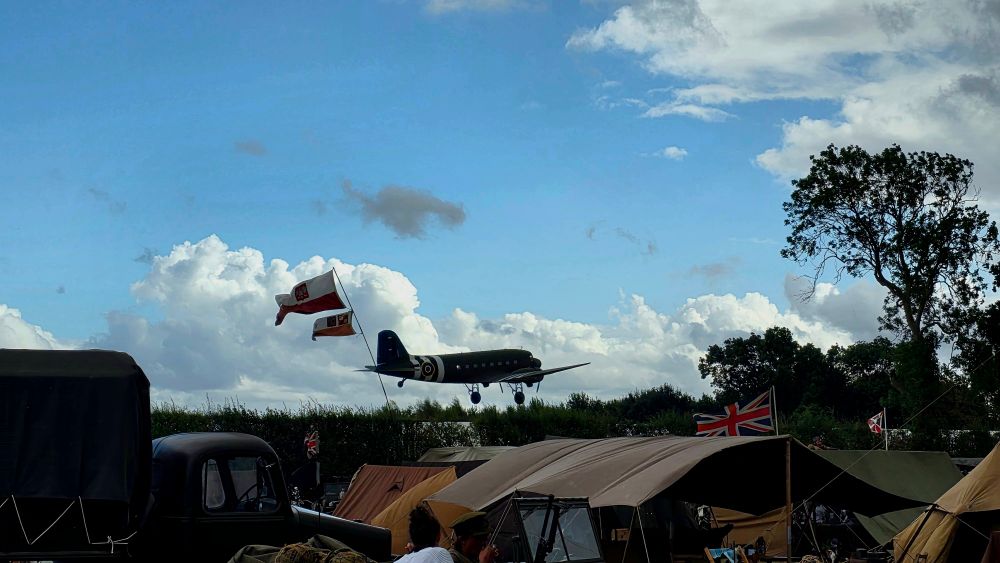 A plane taking off over the camp.