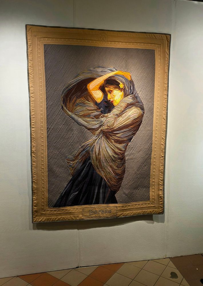 A portrait of wind swept lady made from fabric.