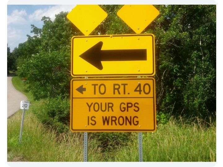 Road sign with an arrow pointing to the left and underneath a sign that reads "To Rt 40. Your GPS is wrong"