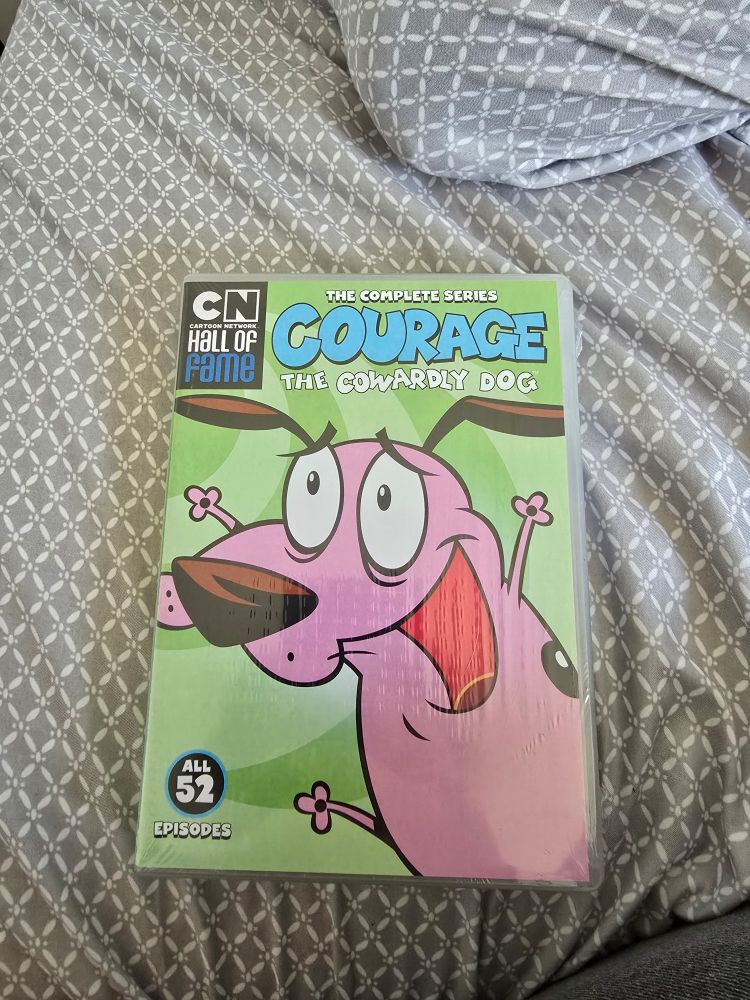 a picture of a DVD box with the complete series of courage the cowardly dog
