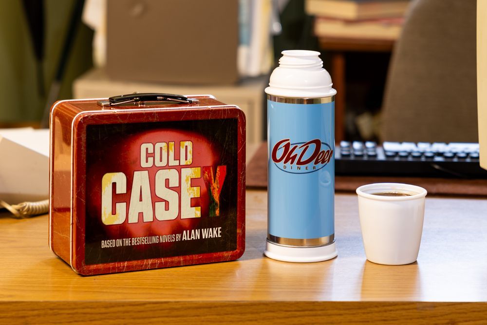 The return of the Alan Wake thermos beside a red metal Cold Casey lunchbox.