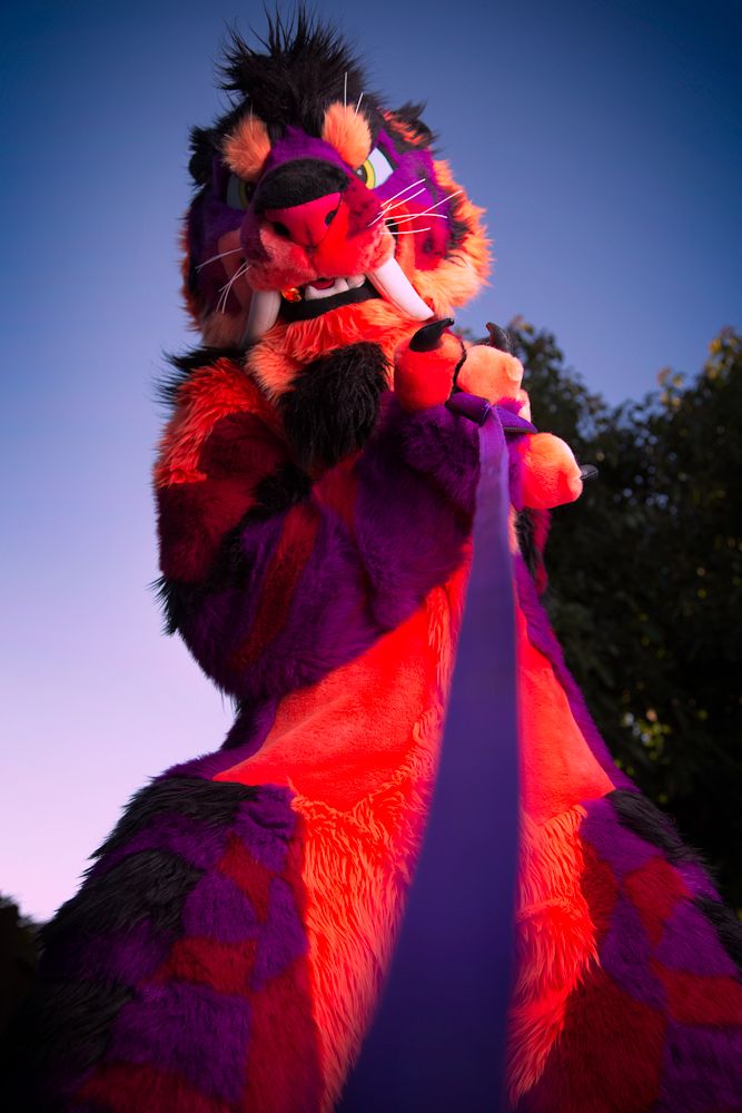 radioactive sabertooth tugging on a leash