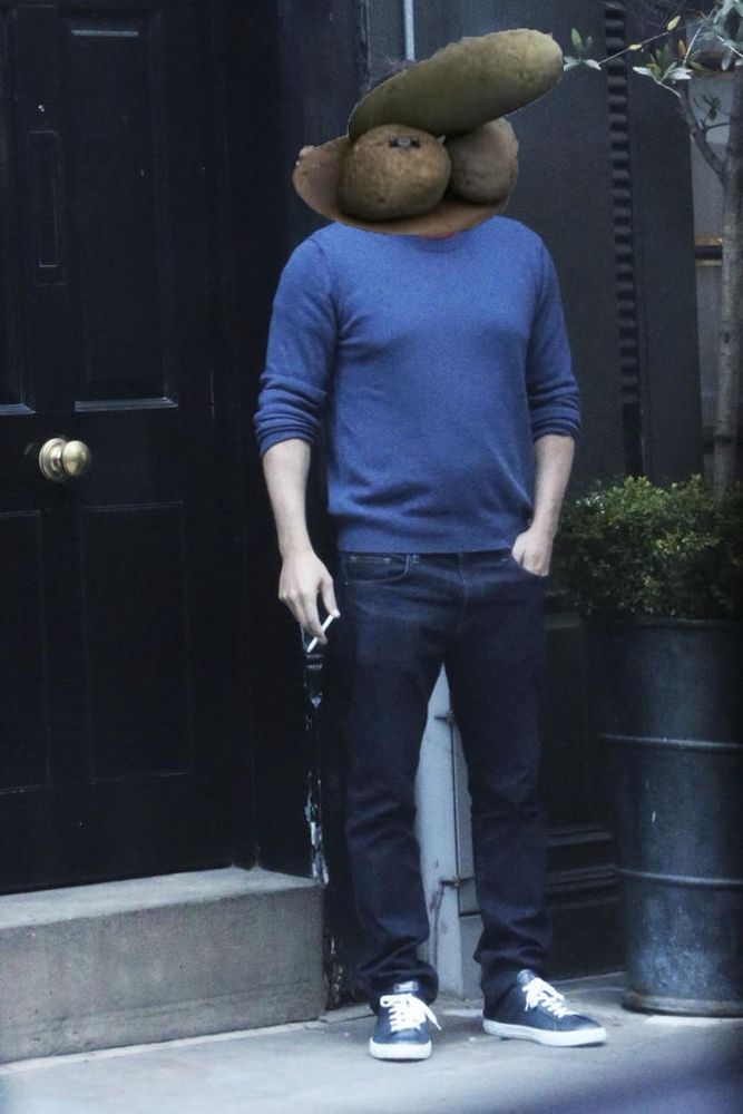 The image is from the Ben Affleck meme where he’s smoking on his front stoop, looking beaten by life. His head has been replaced by a giant penis sculpture from the penis museum.