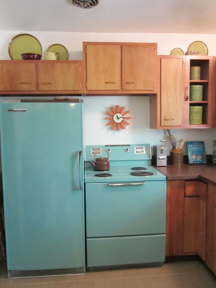 Photo of a 60s era kitchen with pale turquoise refrigerator and stove