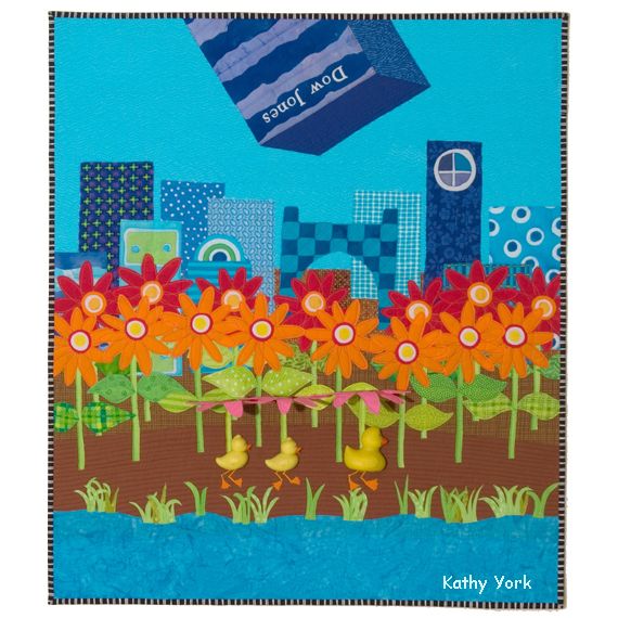 Art quilt of 3D rubber ducklings who are walking through a field of flowers using the flowers as umbrellas to protect them from a giant building falling on their heads. The building has a label, "Dow Jones". 