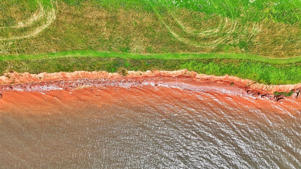 An aerial shot of the coast of Prince Edward Island in Canada. 