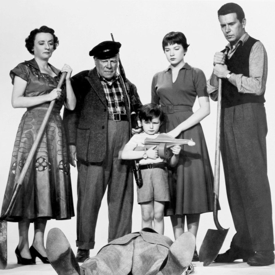 Publicity still for Alfred Hitchcock’s THE TROUBLE WITH HARRY (1955), featuring: Mildred Natwick, Edmund Gwenn, Jerry Mathers, Shirley MacLaine, John Forsythe and “Harry.”