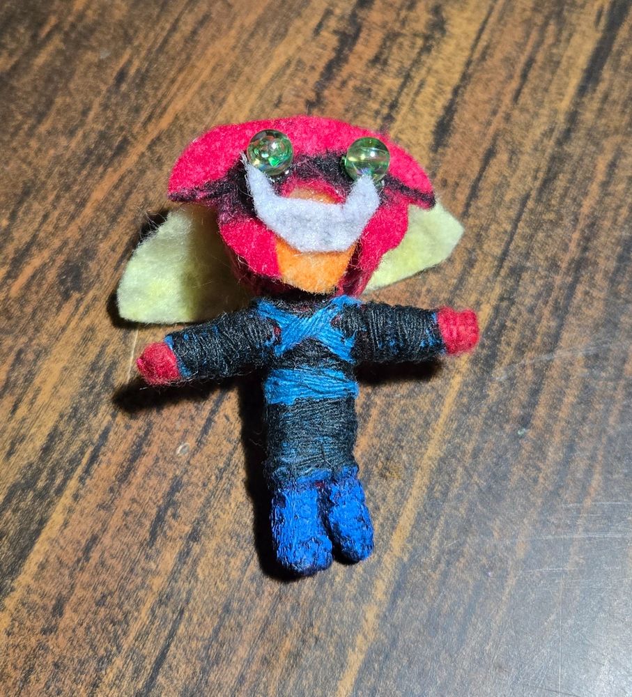 A quarter machine yarn doll modified to look like Brak from Space Ghost 