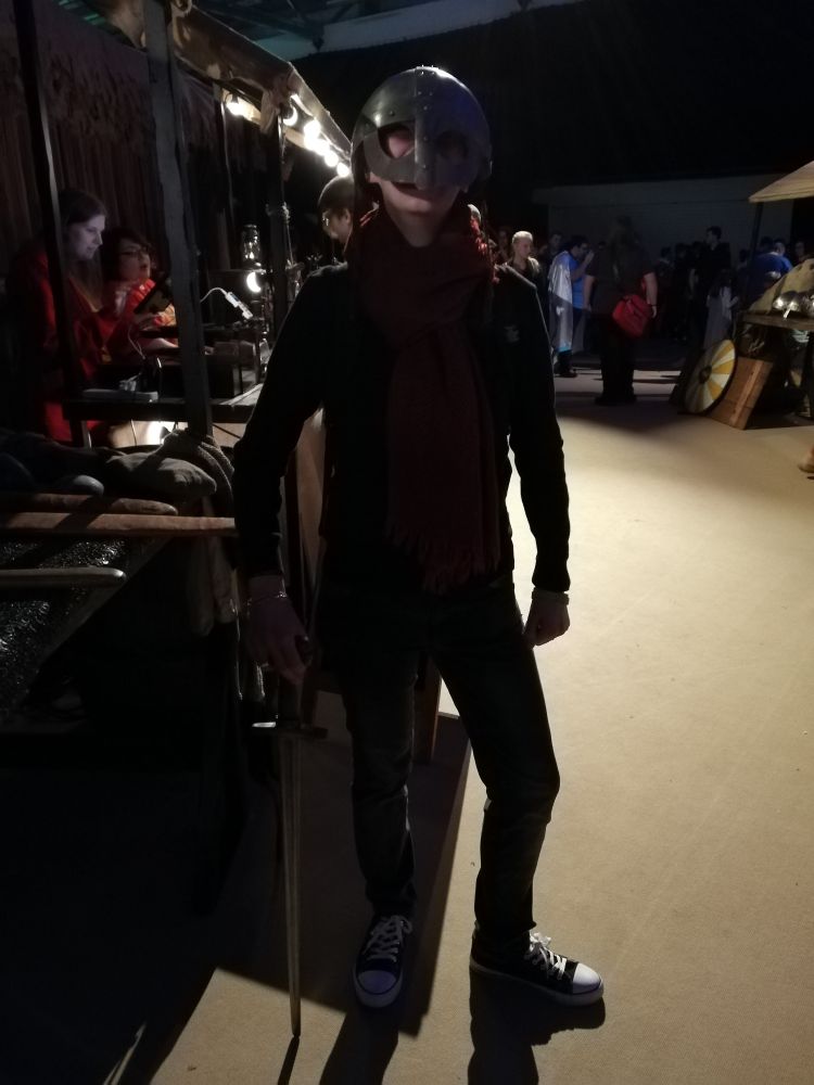 Wearing a helmet and sword