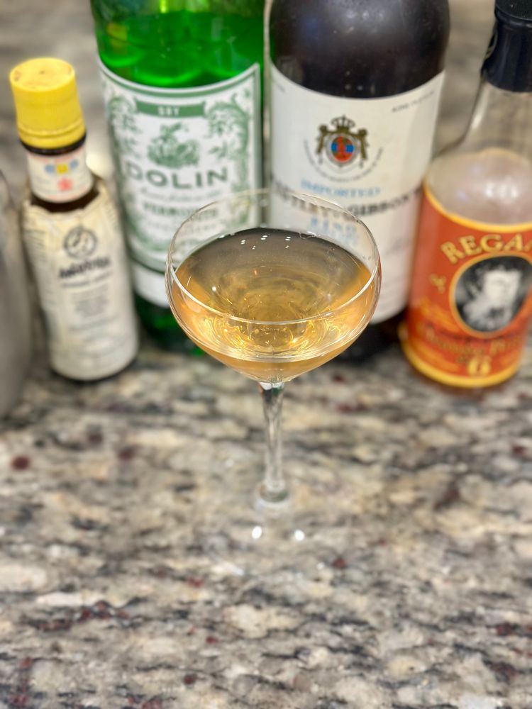 A Bamboo cocktail with ingredients in the background. It’s missing a lemon twist because I’m somehow out of lemons. Sorry. 