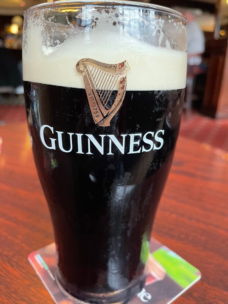 First sip gone from a beautiful pint of Guinness.