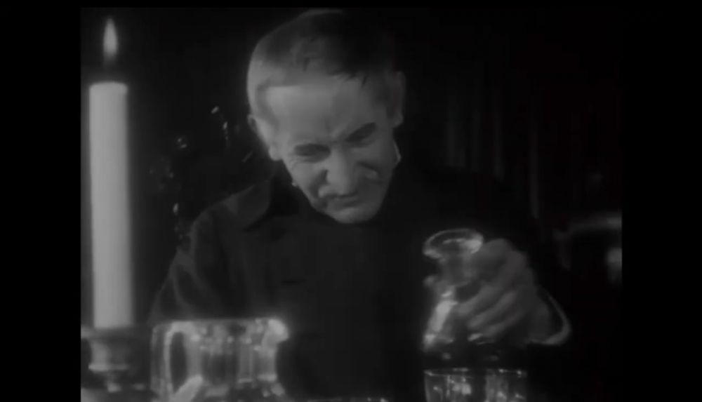 This one shows one of them holding a bottle over a glass