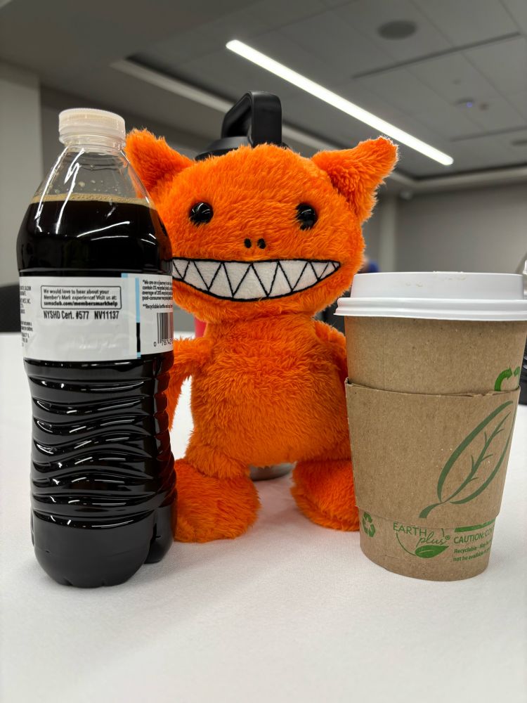 Orange chaos creature and coffee drink