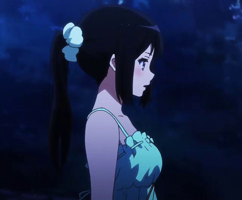 a girl in a blue dress with a white flower in her hair