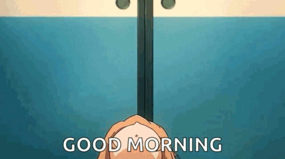 a girl is hanging from a pole with the words `` good morning '' written on it .