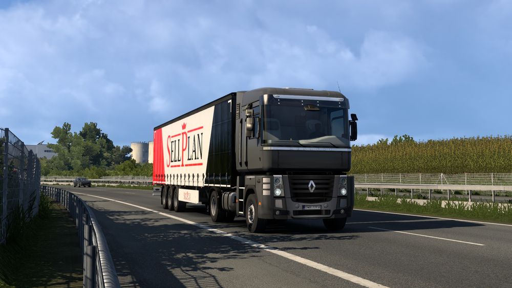 A truck being driven through the european countryside.