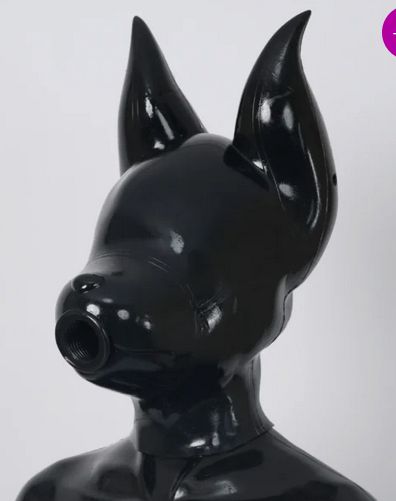 A Feturax velvet hood in all black, its a dog shaped silicone hood with long ears and an oral sex ribbed hole for a mouth.