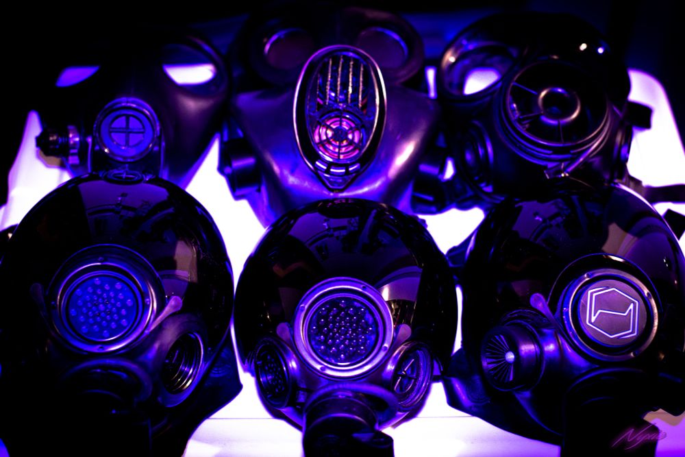 6 gas masks on a white square in high contrast purple lighting in a 2x3 grid.

In order from top left to right:
Israeli, Russian, S10, MSA MPU/2, MSA Millennium (Small), MSA Millennium (Large)
The large MSA has a Hexcorp logo on it and 3d printed intakes by Jan Asleep.

The photo is high contrast and edited.