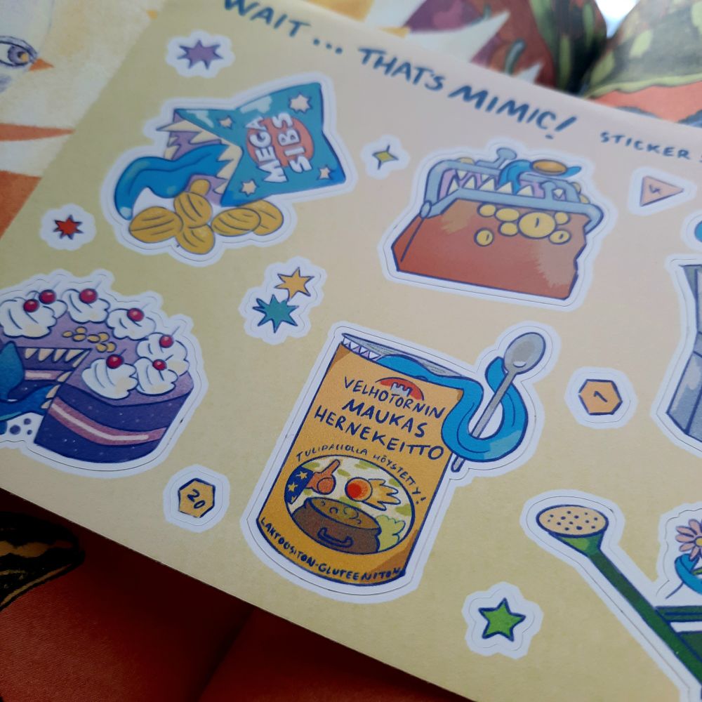 Closeup of the mimic sticker sheet focusing particularly on mimic that has made its home on pea soup can.