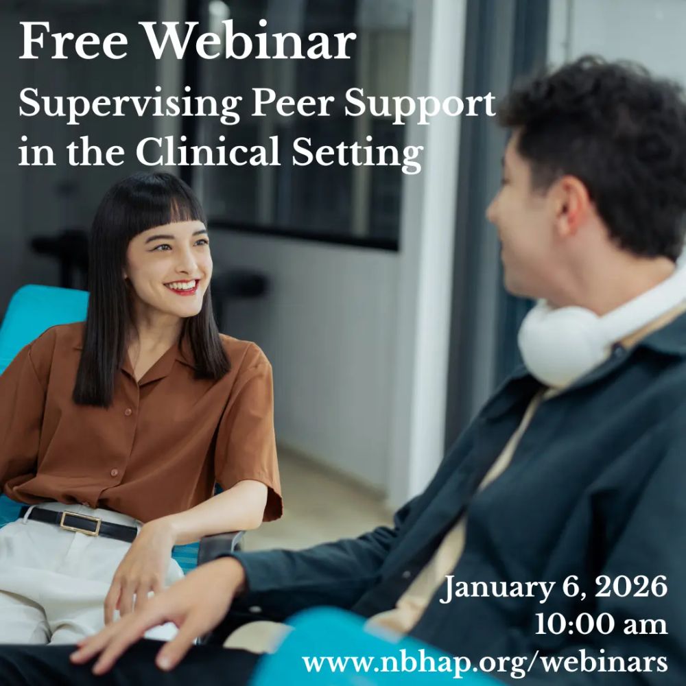 two people having a conversation at an office table. The one on the left is a young Asian woman with long black hair wearing a brown top, and the one on the right is a white man with black hair wearing white headphones around his neck and a blue button-up shirt. Text at the top left reads 'Supervisi