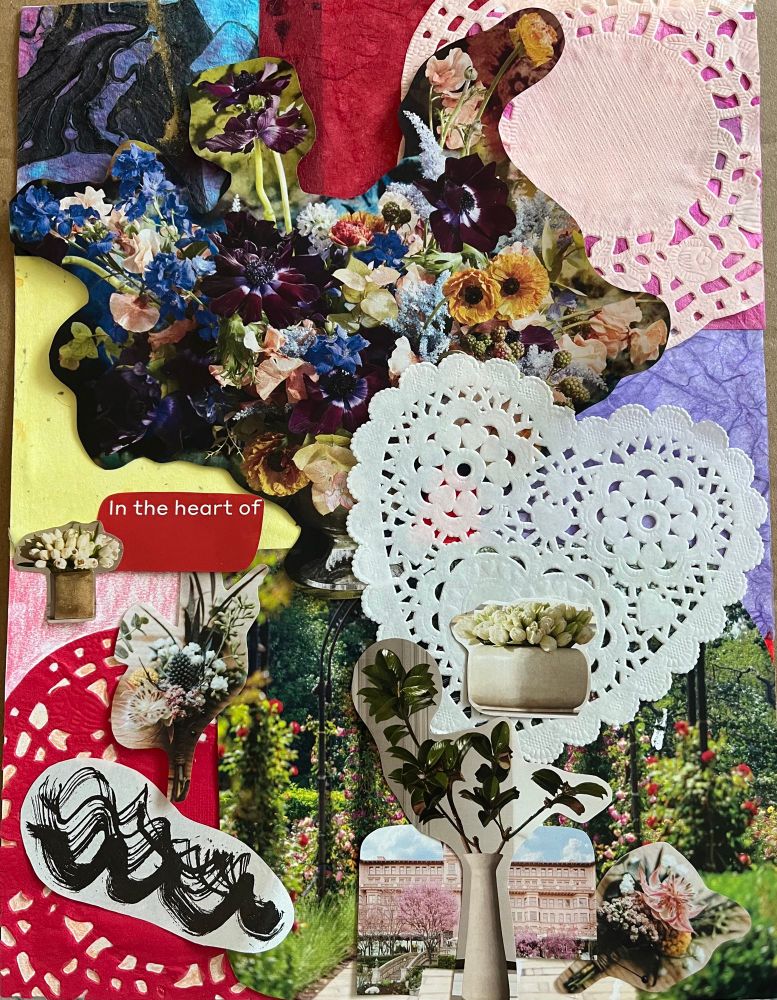 Valentine’s collage in progress — pieces tentatively arranged, not glued down. Mostly florals from magazines, with abstract ink squiggle, white heart doily, and cutout white text on red background that says, “In the heart of”