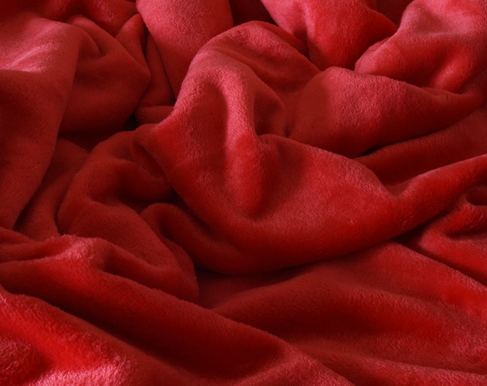 A close-up of the fleece throw showing the soft fleece scrunched up.