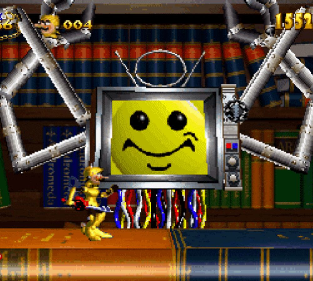 a video game with a smiley face on a television