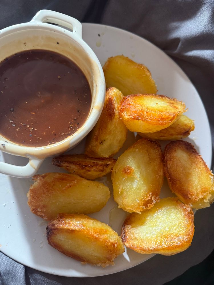 Roast potatoes and a pot of gravy