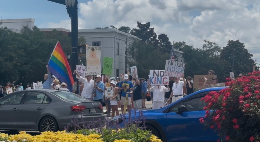 A "No Kings" protest in Beaufort, South Carolina. A pride flag is present among signs that say "No Kings" and "Impeach and Remove" 
