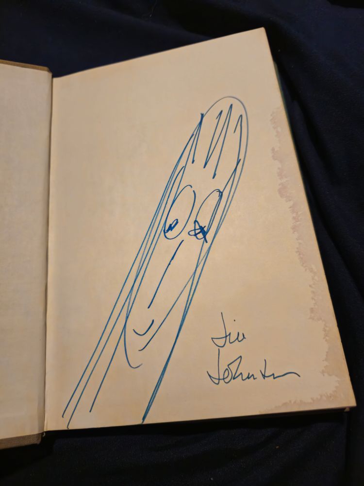 A doodle of a woman and the name Jill Johnston signed on the page 