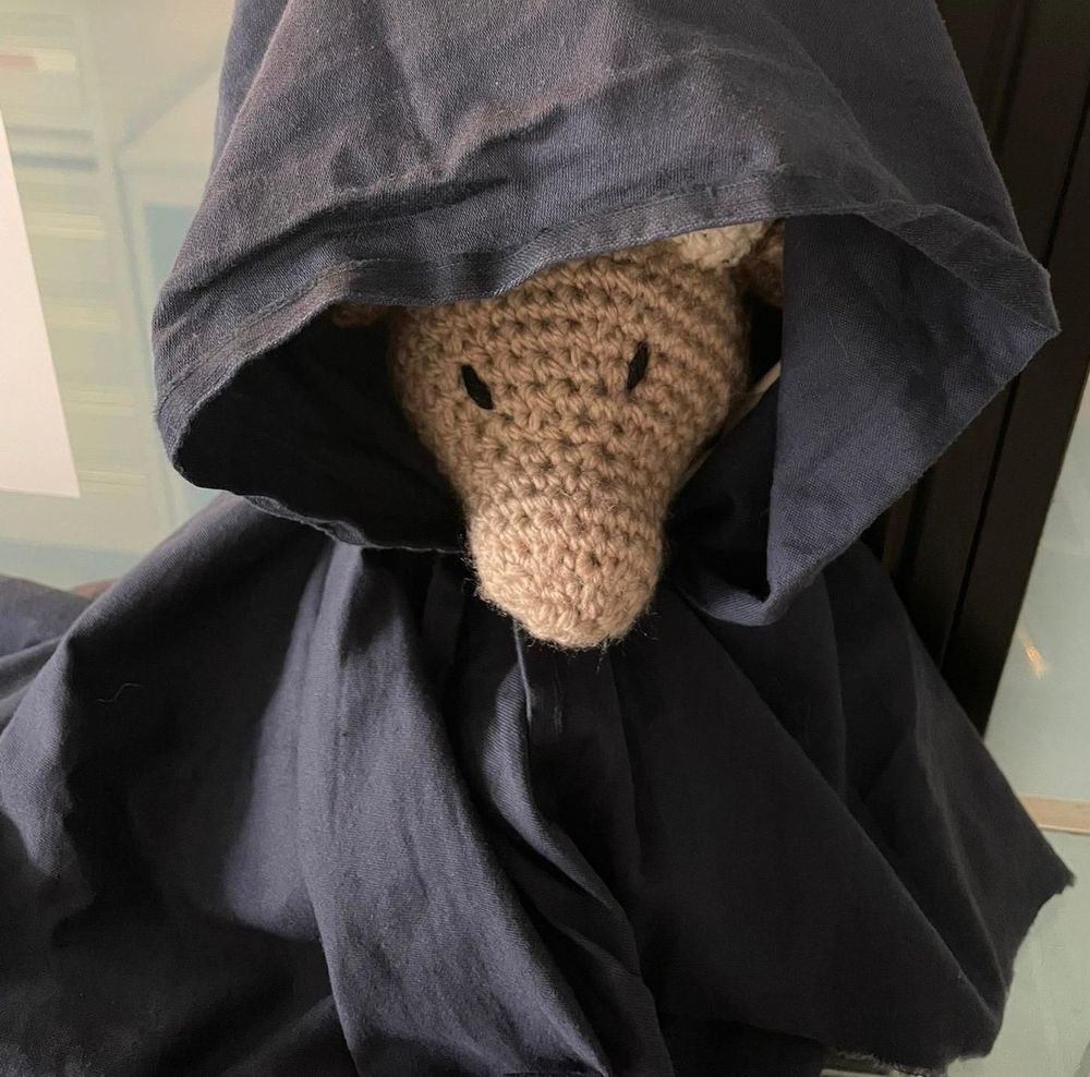 A crochet stag in a cloak