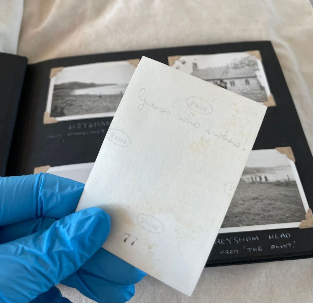 The reverse of a photograph with 'Guess who & where!' annotated on the back