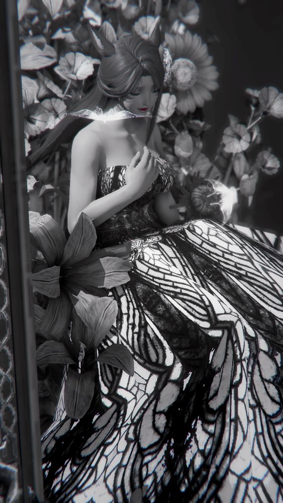 A black and white photo of Annette in a mosiac dress sitting sadly inside of a picture frame with a hand to her chest
