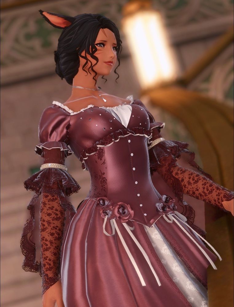 Annette in a red ball gown Walking down a flight of stairs 