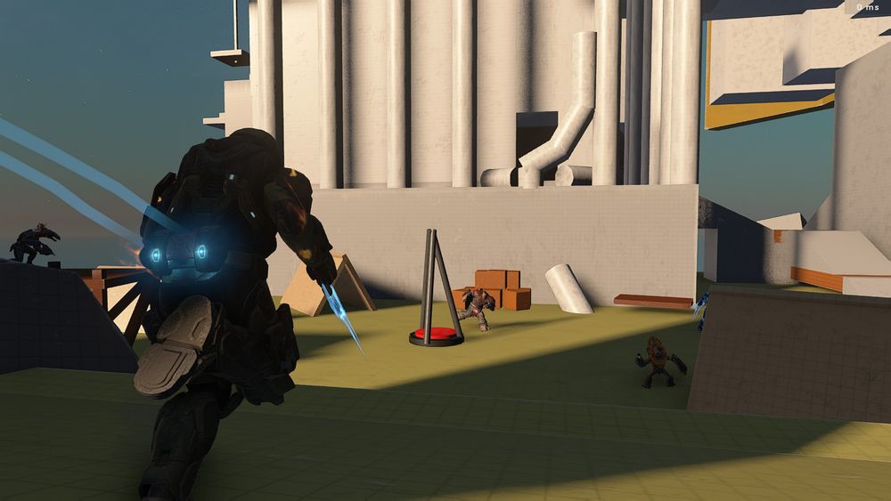 Screenshot of a level blockout from Halo Infinite Forge. A Spartan sprints forward with trailing blue lines, a small encampment with alien enemies facing them, and a tower structure behind with tall columns, partially destroyed.