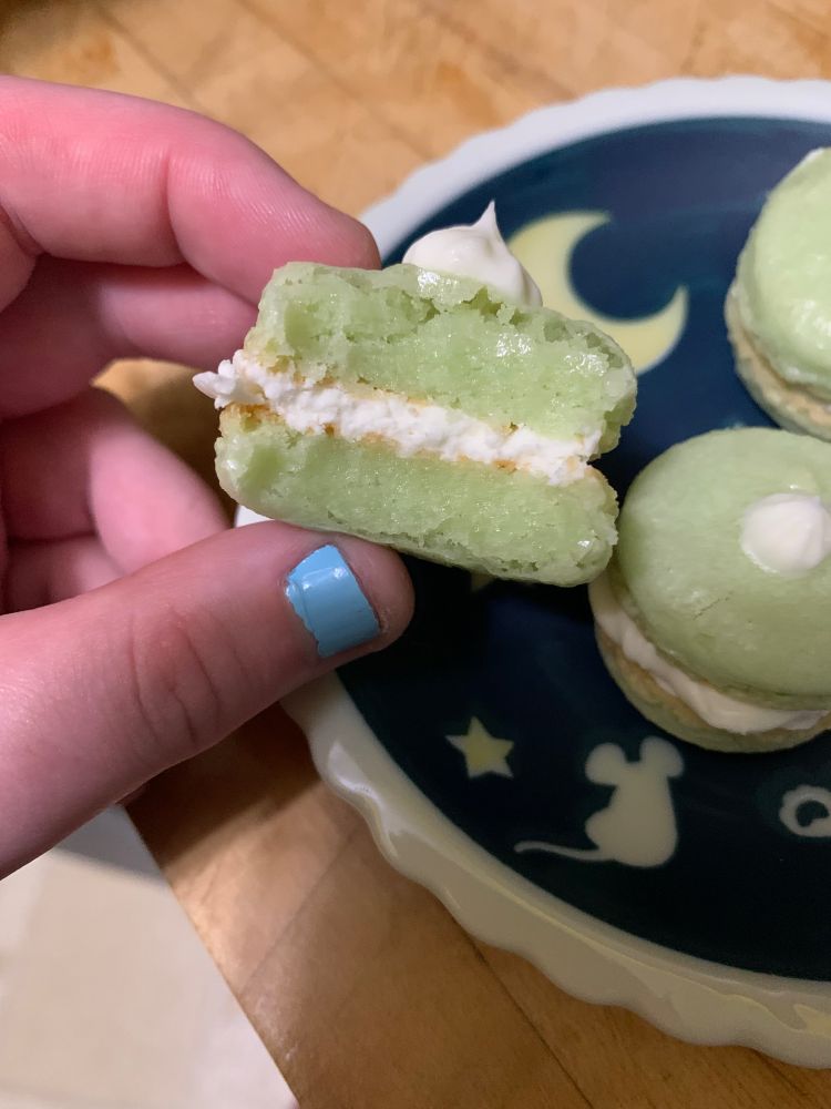 One of the macarons with a bite taken out of it
