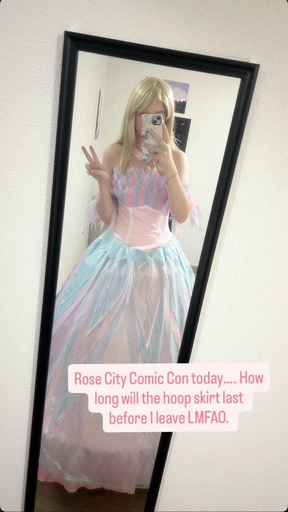 Mirror selfie of a Odette (Barbie Swan Lake) cosplayer. The text says “Rose City Comic Con today…. How long will the hoop skirt last before I leave LMFAO.” 