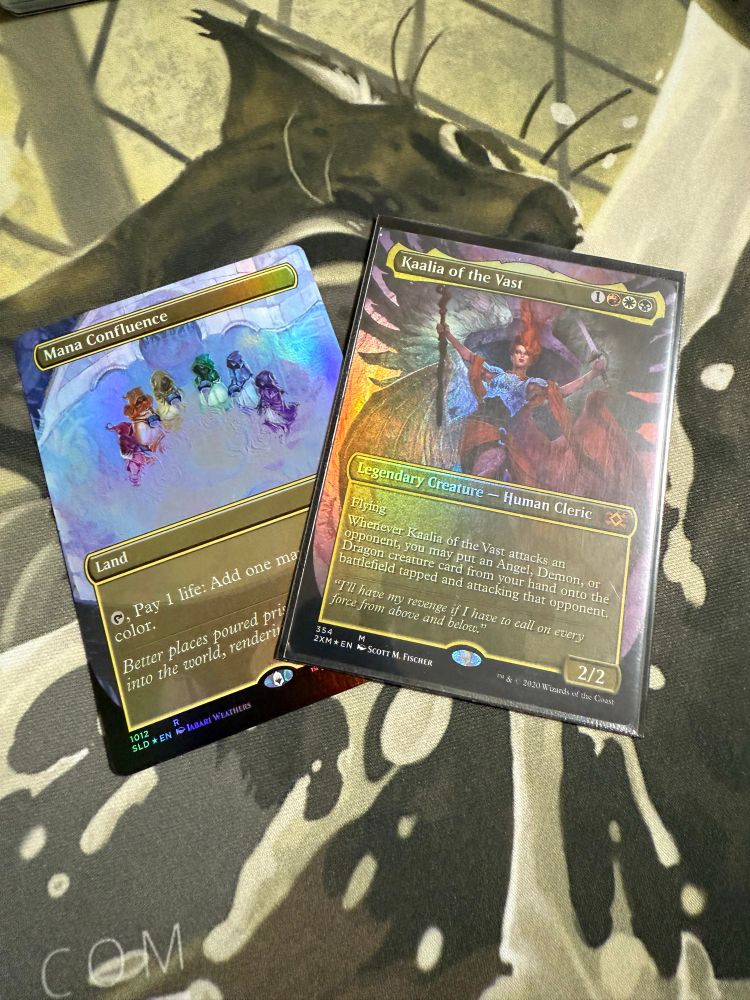 a photo of two magic the gathering cards: mana confluence and kaalia the vast 
