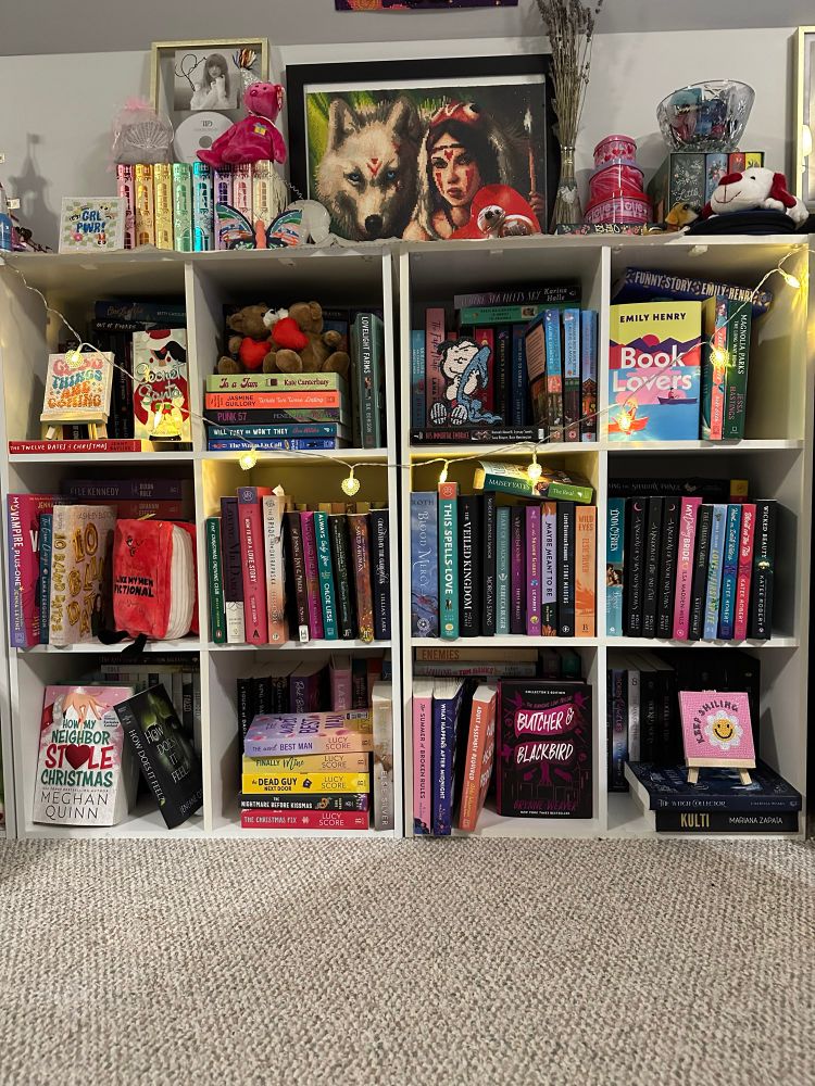 Jumbled bookshelves with heart shaped lights 