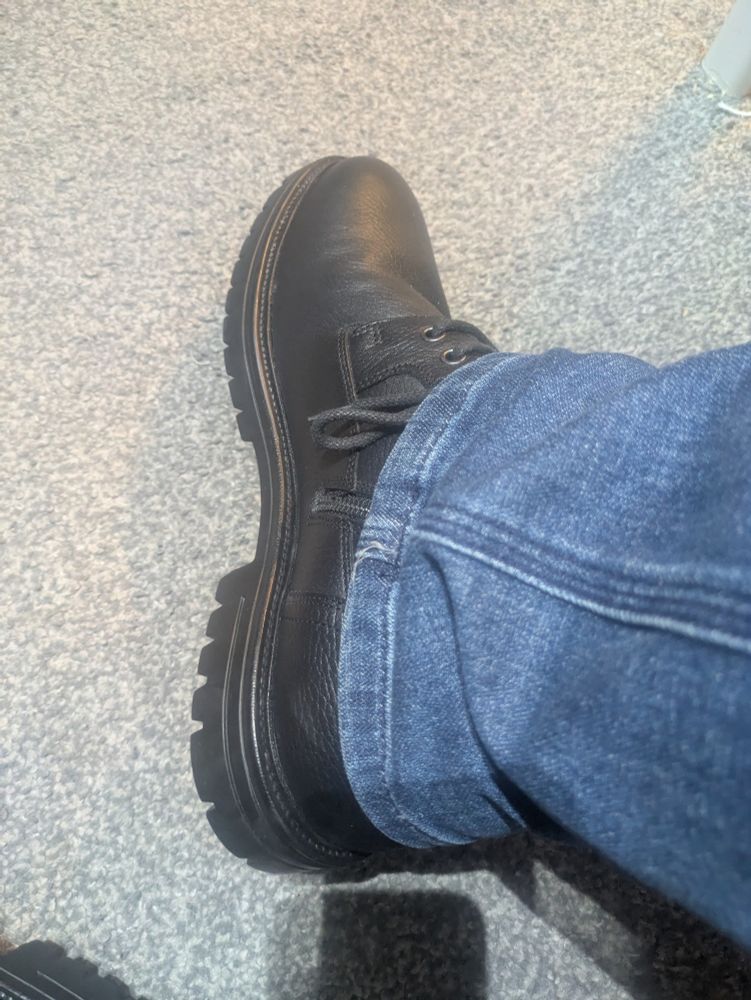 A photo of a black leather boot.