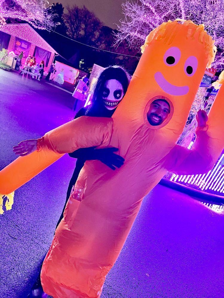 A wacky waving inflatable tube man with a monster on it